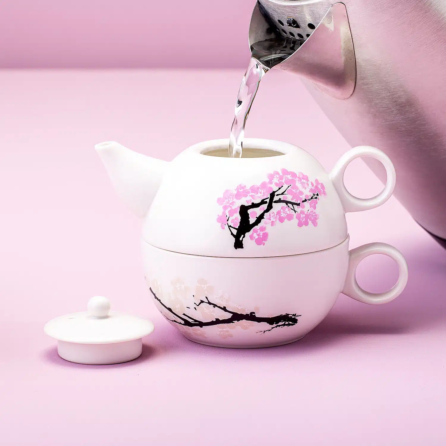 Wärmeempfindliche Blüten Teekanne und -tasse