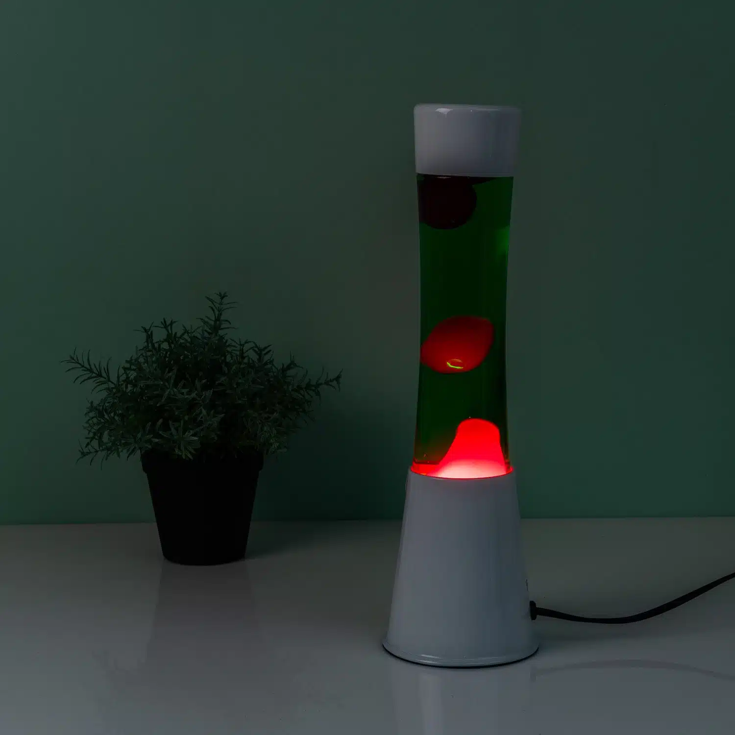 Lavalampe weiß mit grüner Flüssigkeit und rosa Lava