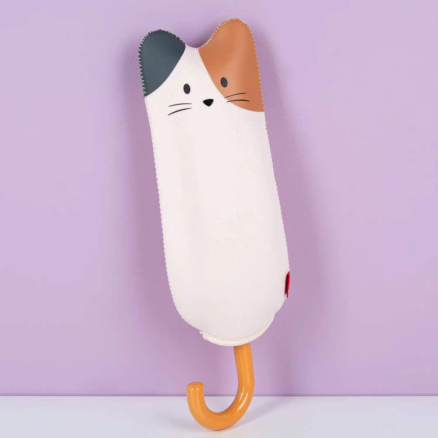 Regenschirm mit Tierhülle