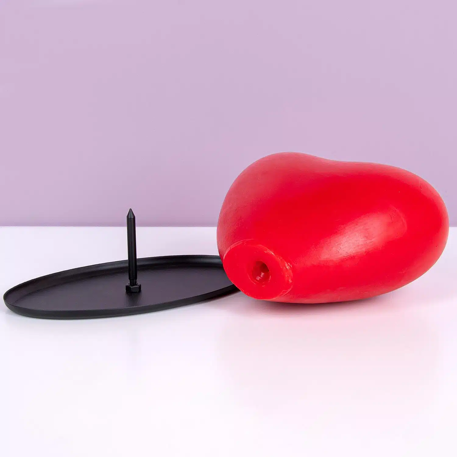 Herzförmige Tropfkerze mit Rosenduft